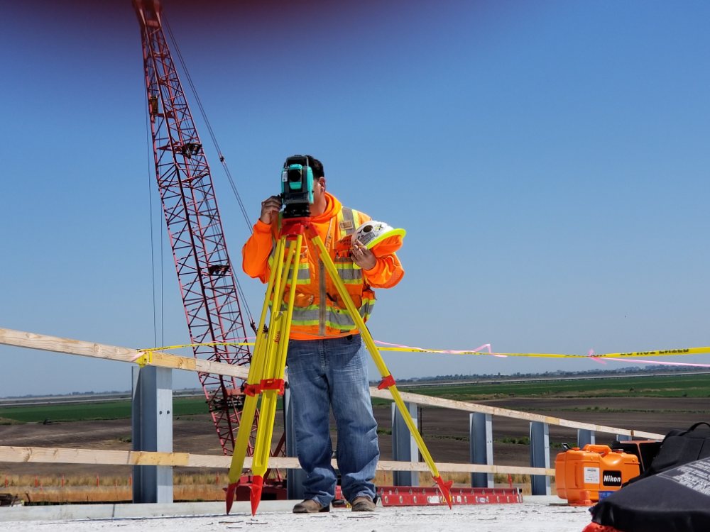 Surveyor in California on construction site